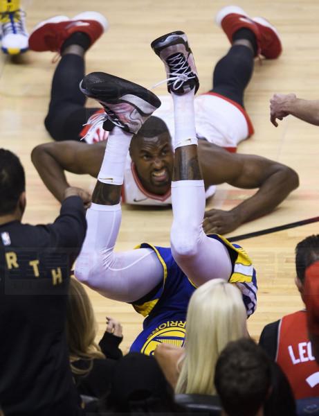 Toronto Raptors centre Serge Ibaka, back centre, fouls Golden State Warriors forward Kevin Durant (35) during first half Game 5 NBA Finals basketball action in Toronto on Monday, June 10, 2019. THE CANADIAN PRESS/Nathan Denette