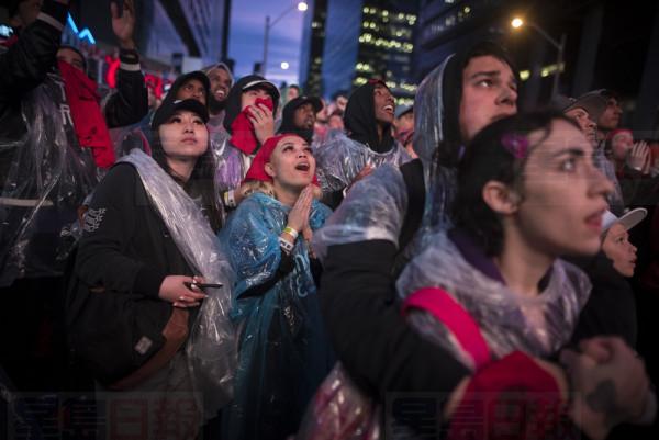 Raptors fans react from the Jurassic Park fanzone outside of Scotiabank Arena during game Game 5 of the NBA Final between Toronto Raptors and Golden State Warriors in Toronto Monday, June 10, 2019. THE CANADIAN PRESS/ Tijana Martin