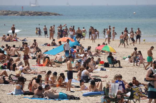 以色列解除户外戴口罩禁令 再向正常化迈进