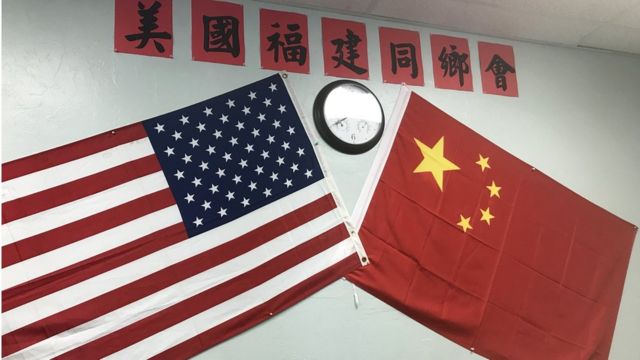 A Chinese and American flag on the wall of the Fujianese association