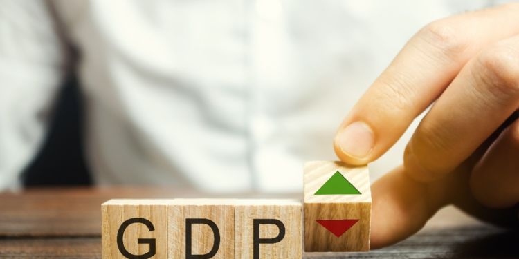 Wooden blocks with the word GDP and up and down arrows