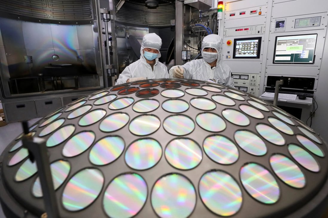 Employees work on the semiconductor chip production line of Jiangsu Azure Corp in Huaian, Jiangsu province, China, on March 25. Photo: China Daily via Reuters
