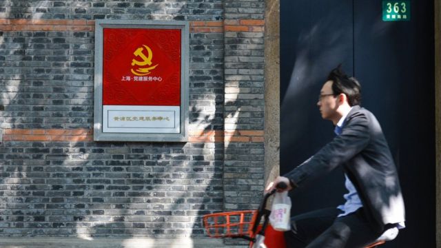 A cyclist passes near the birthplace of China's Communist Party in Shanghai, where Mao Zedong and 12 other delegates met in secret in July 1921. On Tuesday, 31 October 2017, in Shanghai, China.