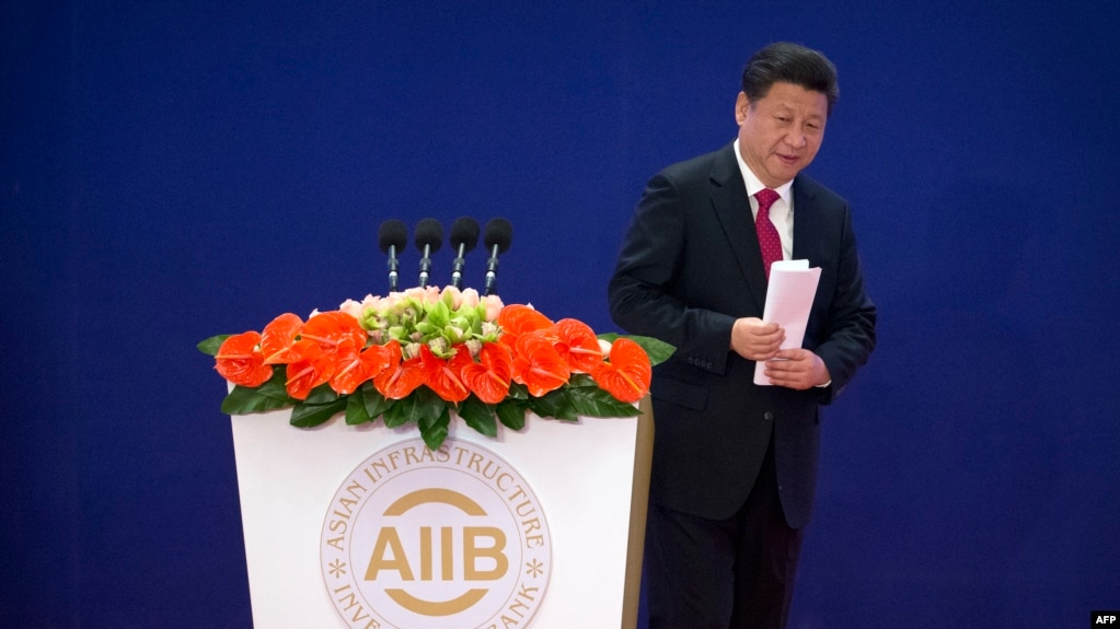 中国国家主席习近平2016年1月16日在亚投行开幕式上致辞。（法新社）
