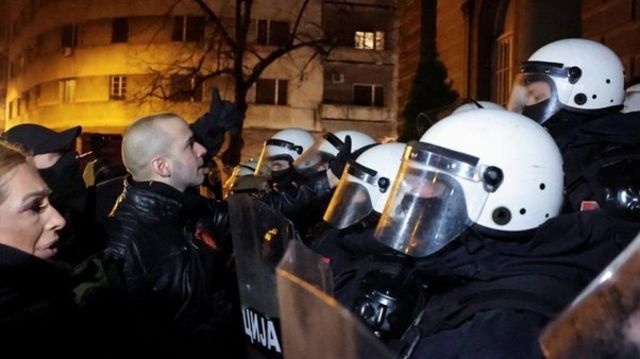 Protestors and police stand face to face in Belgrade