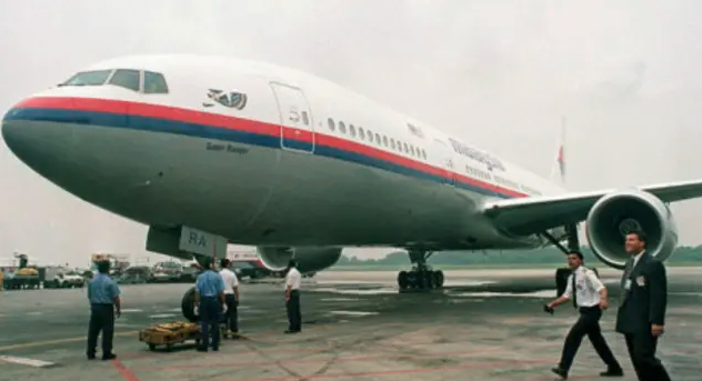 ����ʧ��12�� ����MH370��������ͥ ������ŭ
